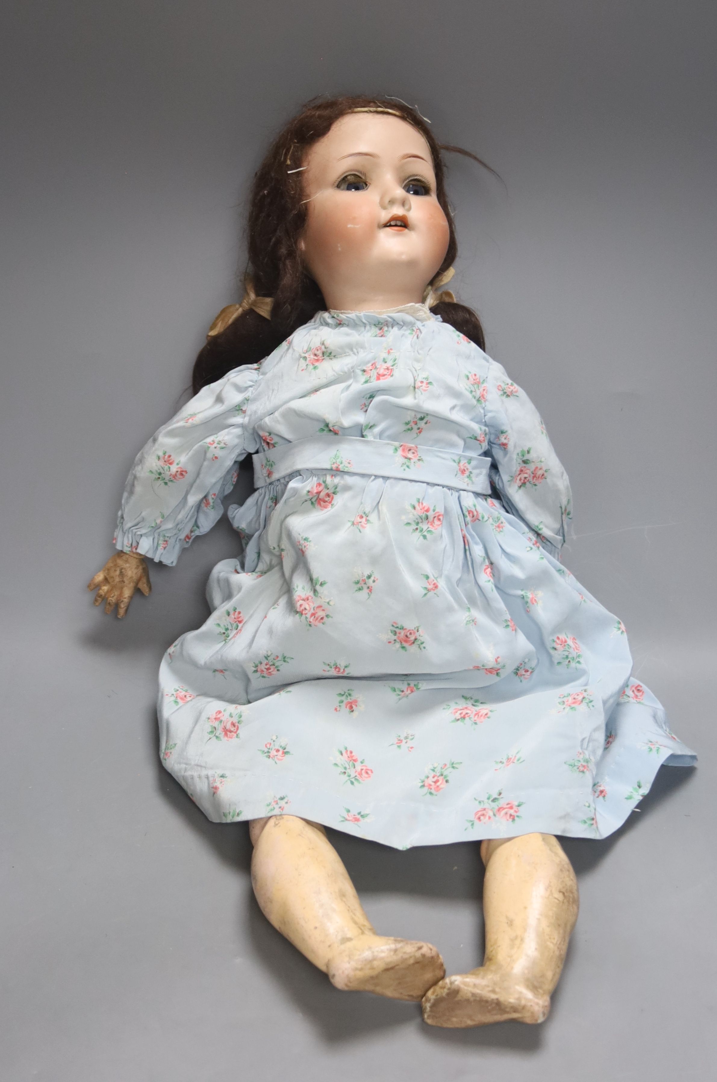 An A M 390 Bisque head doll, stamped AM, open mouth